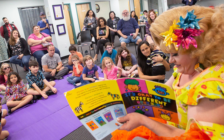 Rich Kuntz, also known as Gidget, reads to children during Drag Queen Story Hour on March 21, 2019